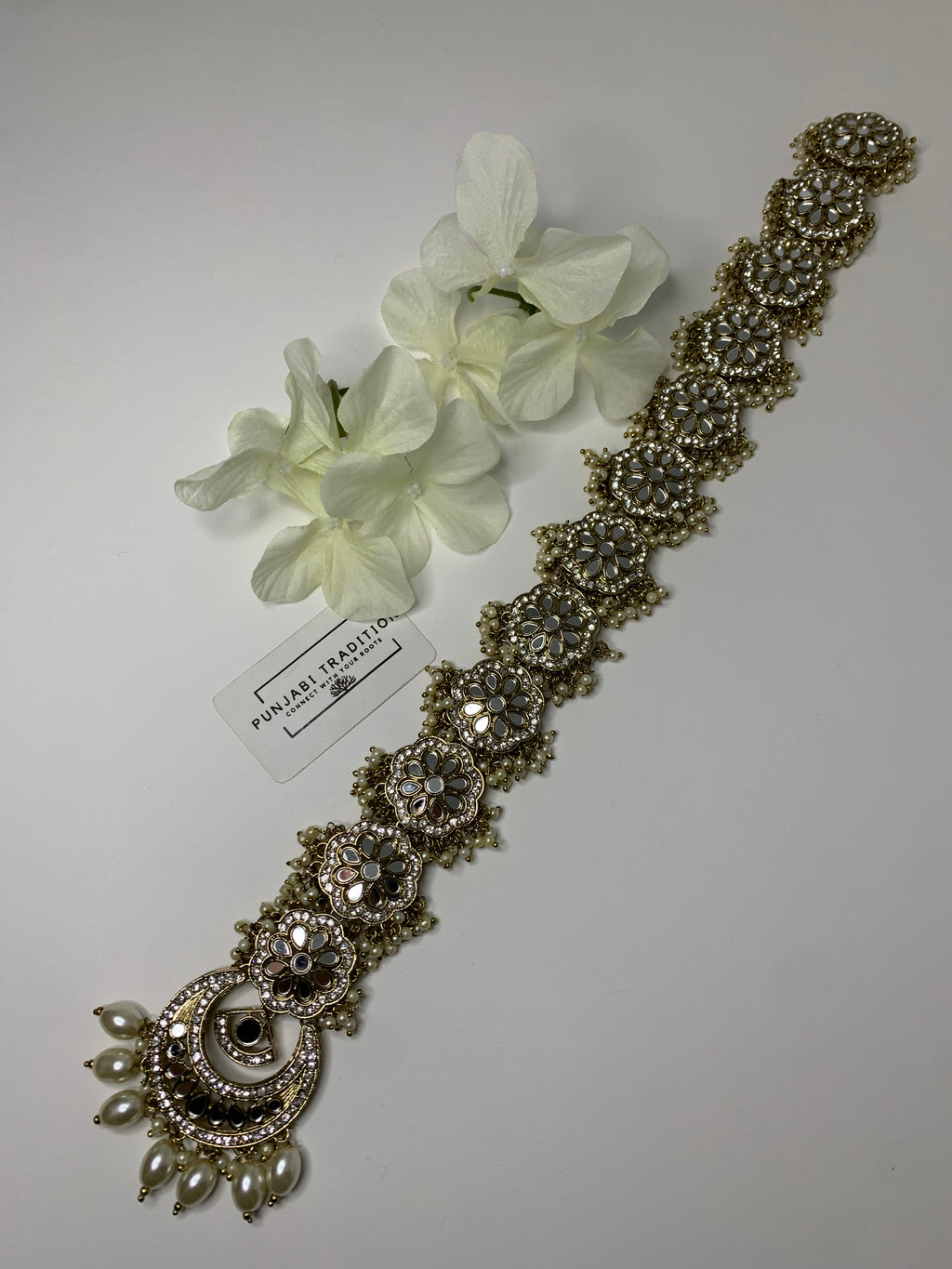 Rai  flower mirror hair accessory